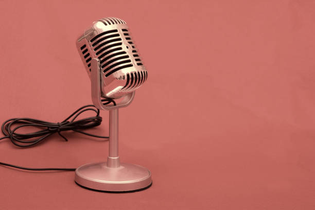 istock Old Microphone stock photo on pink background 1083309216
