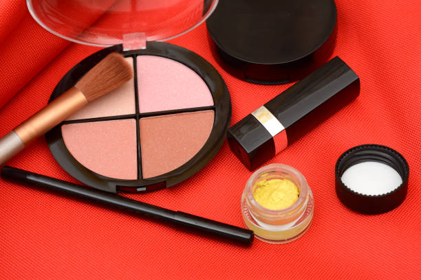 istock Collage of cosmetics, makeup material on red fabric 1083309240