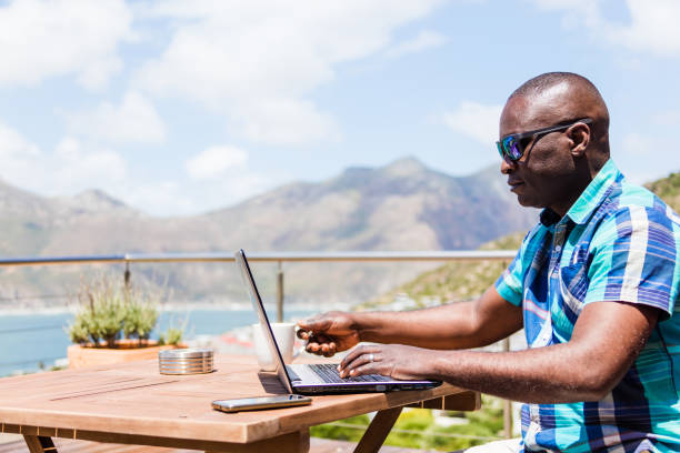 istock African guy writing on his laptop 1083309682