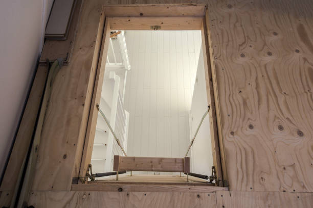 Wooden staircase to the attic in a modern house empty Wooden staircase to the attic in a modern house empty folding staircase interior of old house garret stock pictures, royalty-free photos & images