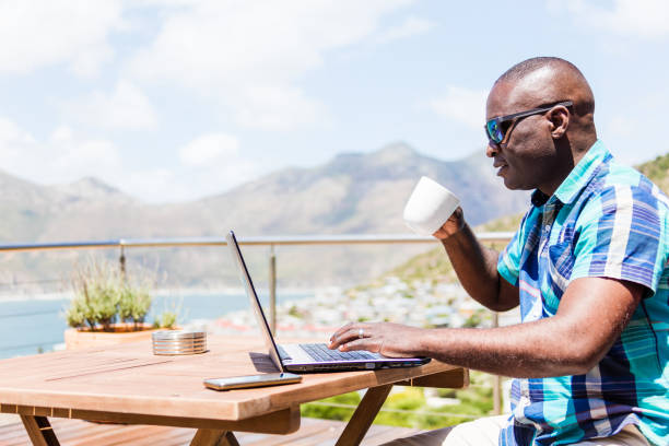 istock African guy writing on his laptop 1083310492