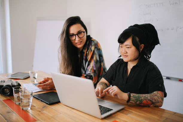 istock Young women working together in a small Berlin start-up office 1083312850