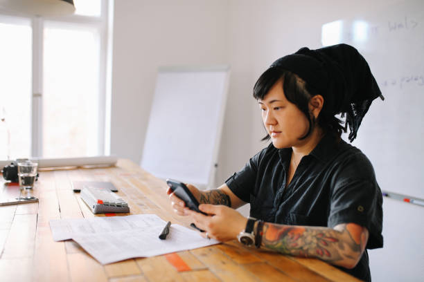 istock Young woman in a small startup Berlin office 1083314370