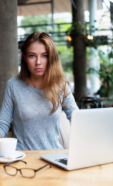 istock a pretty woman behind her laptop 1083314738