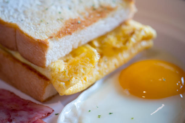 istock Close up breakfast with toast and fried yolk yellow eggs. Breakfast concept 1083316866