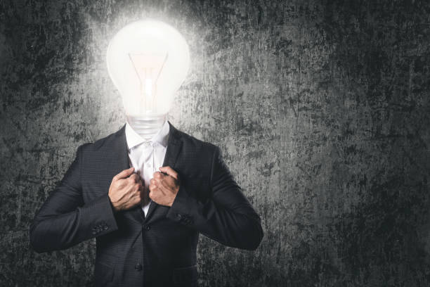 istock Got an idea! Businessman with light bulb instead head. 1083318552