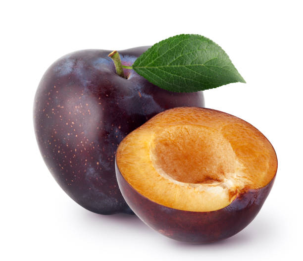 istock Isolated plums. Whole and a half of blue plum fruit isolated on white background 1083318814