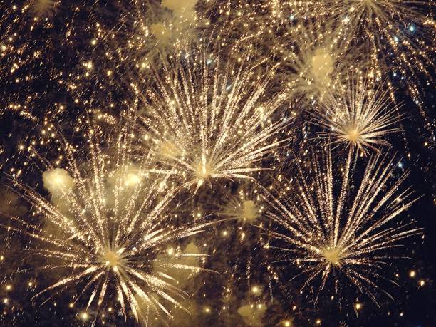 istock abstract, fireworks, blurred image. Christmas background. Light with glowing sparks, merry christmas 1083319084