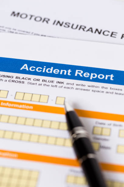 istock Motor or car insurance accident report form with pen 1083320870