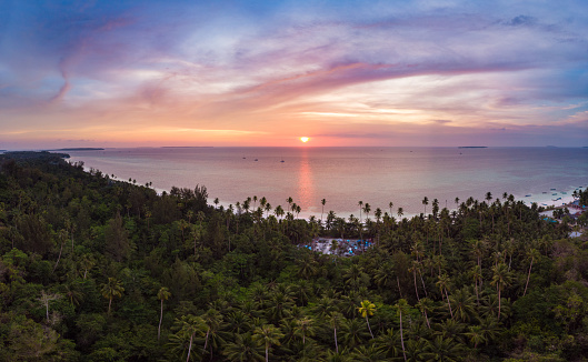 Aerial view tropical beach island reef caribbean sea dramatic sky at sunset sunrise. Indonesia Moluccas archipelago, Kei Islands, Banda Sea. Top travel destination, diving snorkeling