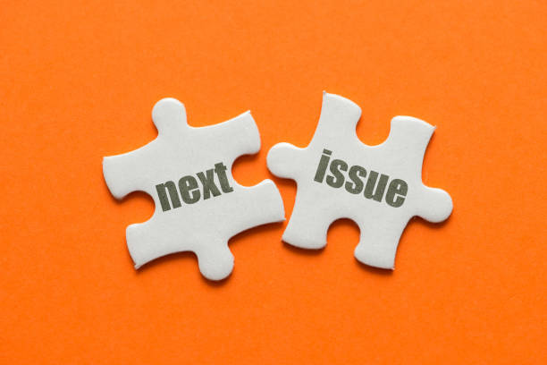 istock The word Next issue on two matching puzzle on orange background 1083323560