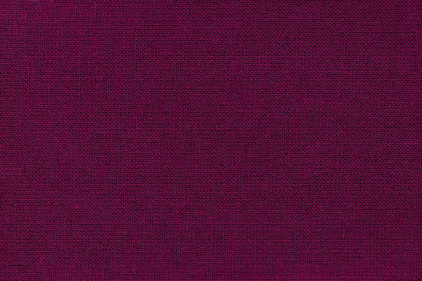 istock Dark purple background from a textile material. Fabric with natural texture. Backdrop. 1083325238