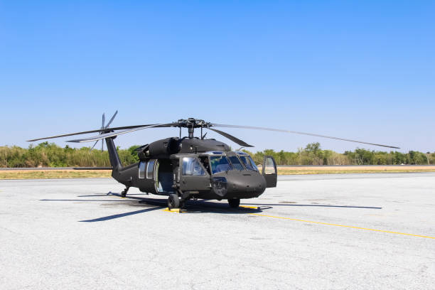 istock Military helicopter blackhawk at a base 1083325900