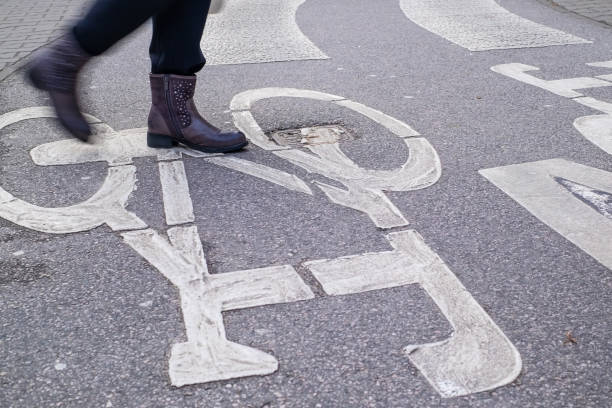 istock pedestrian crossing across curved bicycle asphalt line 1083326594