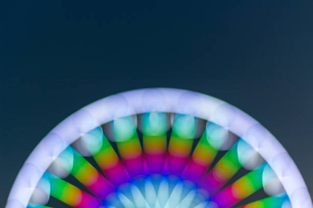 istock Defocused ferris wheel with colorful lights 1083329142