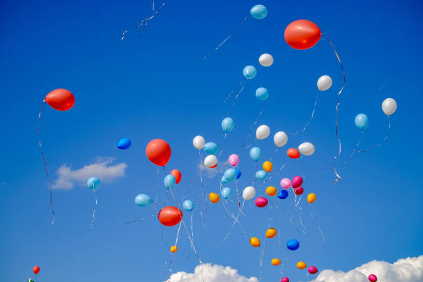 istock multicolored balloons against the blue sky 1083334268