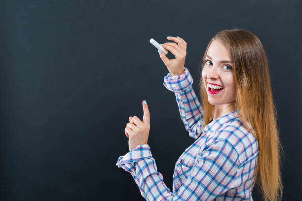 istock Woman holding a chalk 1083336214