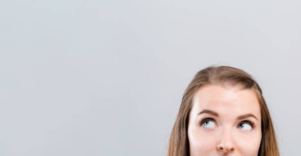 istock Young woman looking upwards 1083336366