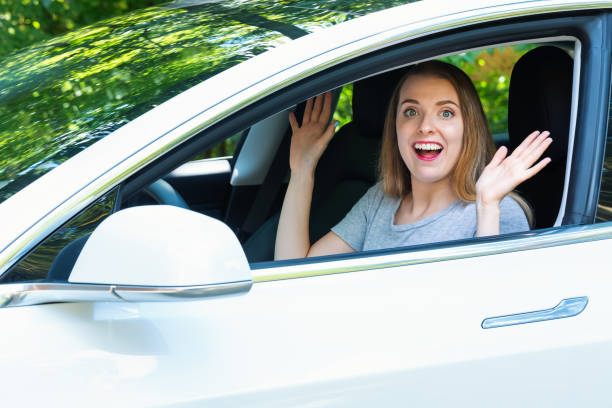 istock Young woman in a self driving car 1083336398