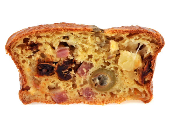 slice of cake with olives, ham and dried tomato