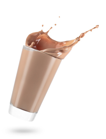 glass of spilling chocolate milk with splash isolated on white background