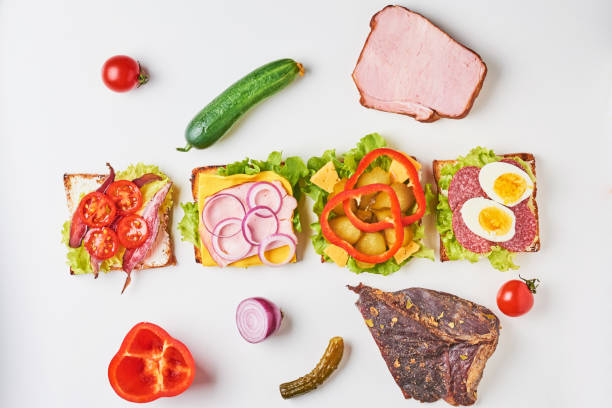 istock Different kind of sandwich and ingredients on a white background, top view 1083344596