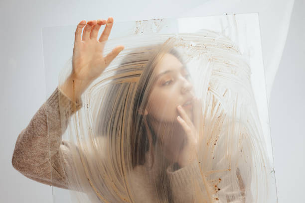 istock Beautiful young woman at muddy glass 1083348732