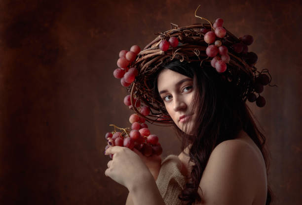istock Beautiful girl with grapes. 1083349174