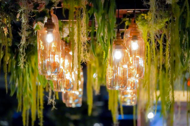 Ornate chandeliers are suspended from vaulted ceilings embellished with columns and arches, emitting a warm glow that imparts an elegant and dignified atmosphere to the space