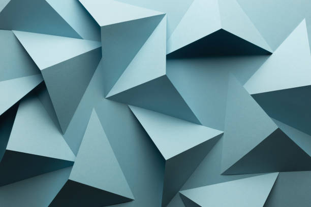 istock Close-up of triangular shapes of paper, abstract background 1083352692