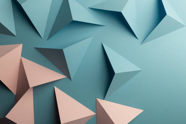 istock Close-up of triangular shapes of paper, abstract background 1083353826