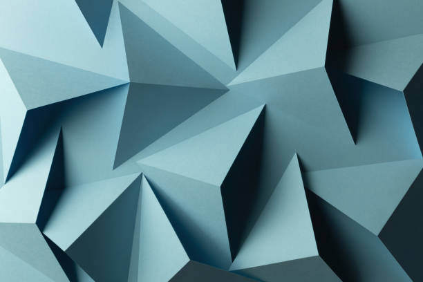 istock Close-up of triangular shapes of paper, abstract background 1083354006