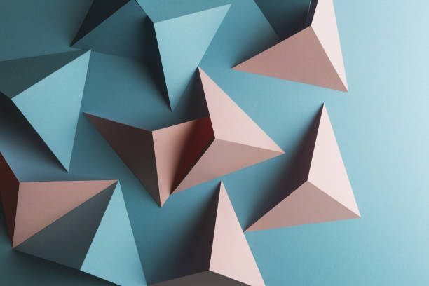 istock Close-up of triangular shapes of paper, abstract background 1083354302
