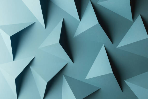istock Close-up of triangular shapes of paper, abstract background 1083356408
