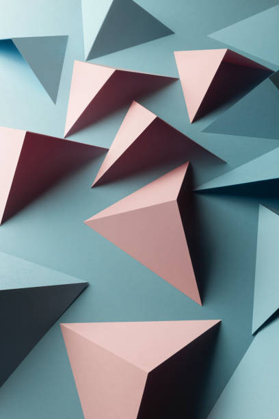 istock Close-up of triangular shapes of paper, abstract background 1083356506