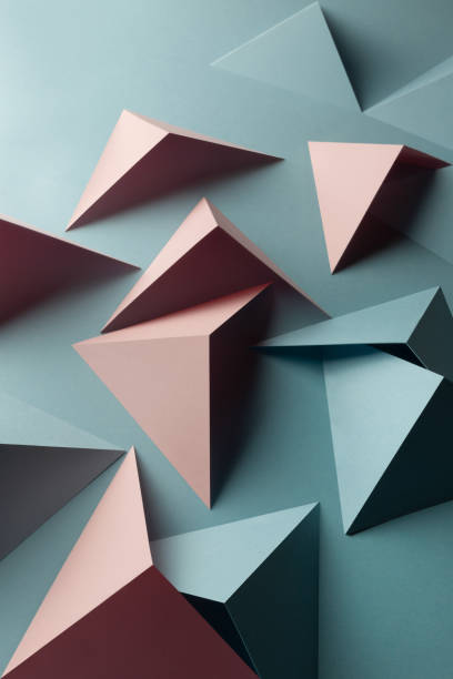 istock Close-up of triangular shapes of paper, abstract background 1083357236