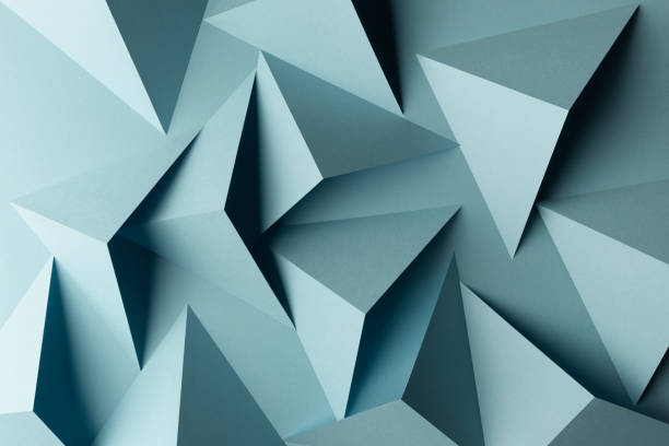 istock Close-up of triangular shapes of paper, abstract background 1083359892