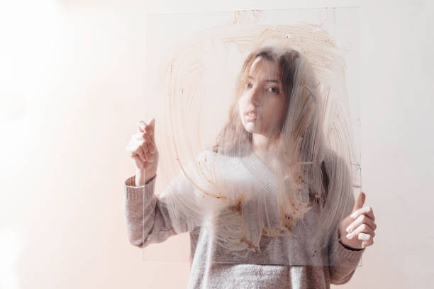 Mystery woman holding muddy glass