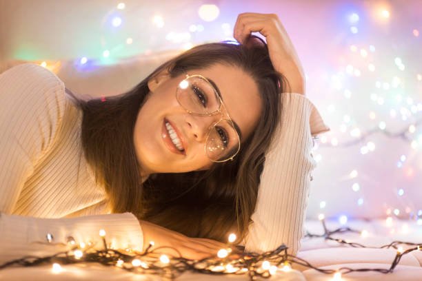istock Woman with glasses lying down and smiling 1083363058