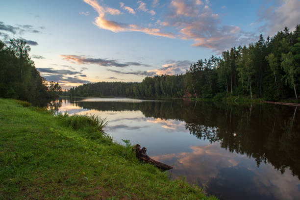 istock blue sky white clouds over calm body of water 1083363292