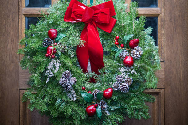 istock Christmas wreath on wooden door 1083369110