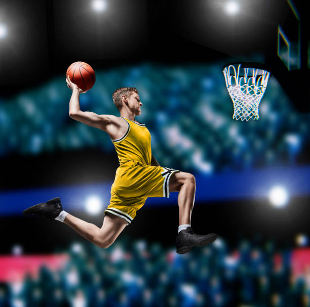 istock basketball player making slam dunk on basketball arena 1083372456