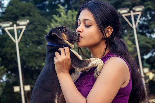 Young teenager woman with little puppy