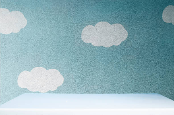 istock beautiful grey blue wall with clouds and empty white tabletop in cute dark nursery 1083373722