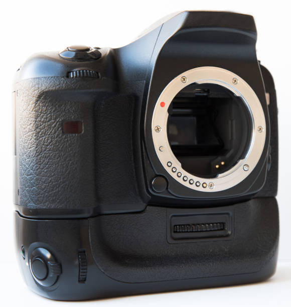 istock Digital SLR camera with lens and vertical battery grip isolated 1083376580