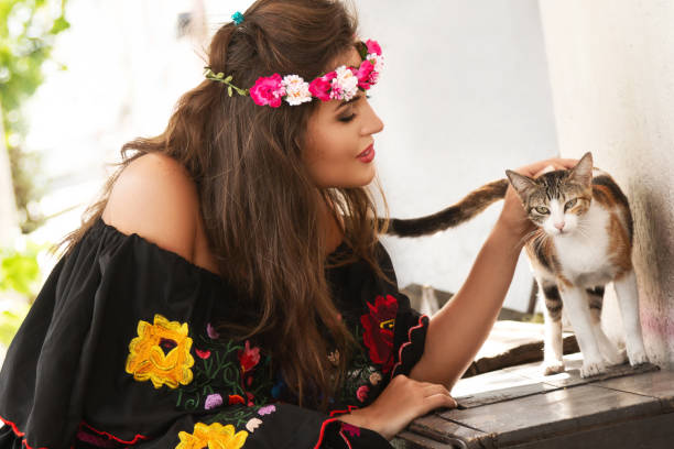 istock Young happy woman and stray cat 1083376890