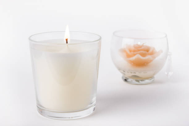 white wax candle in glass on white background - decoration candle ornate composition imagens e fotografias de stock