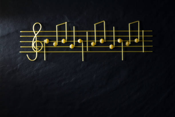 istock Musical Christmas sheet music paste isolated on a black textural background. 1083387750