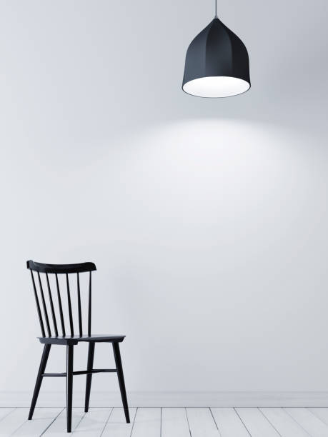 istock Empty wall for mock up on the white wall with black chair and lamp in minimalist interior. 1083390084