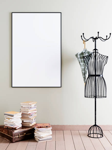 istock Mock up poster frame in interior with decorative hanger and an old suitcase with books. 1083391130